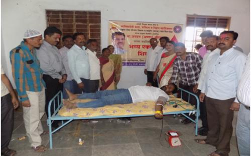 A volunteer donating blood on the occasion of   Birthday of Hon. Jaydattaji (Anna)
